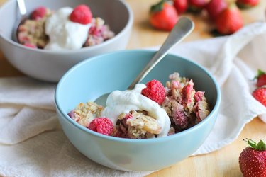 Top mixed berry baked oatmeal with whipped cream or yogurt.