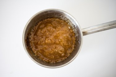 Simmering mixture in a saucepan.