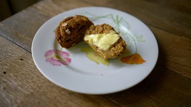 Fresh-baked pumpkin oat blender muffin with grass-fed butter