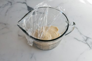 Cover the bowl and let the dough rise.