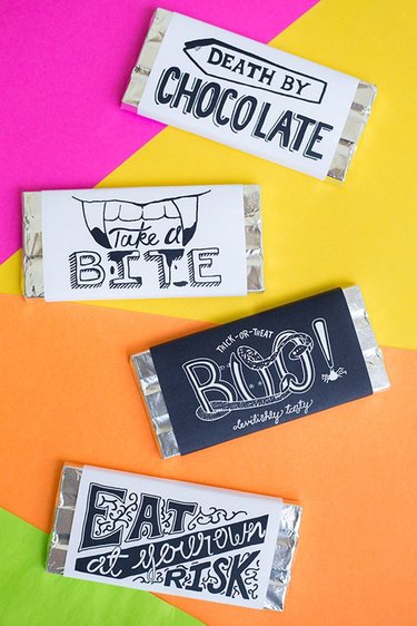 Four different printable candle labels on a colorful background