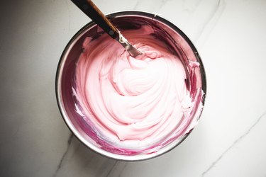Add a few drops of food dye to color the pre-packaged frosting.