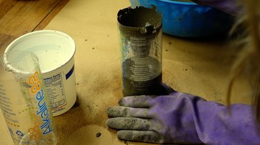 Filling plastic bottle with cement for DIY candles with cement base project
