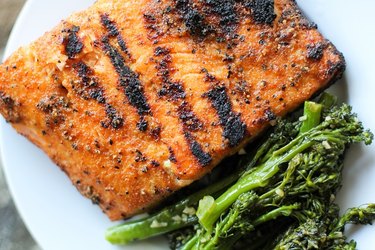 Grilled salmon on a plate with broccolini