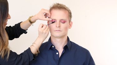 Applying mascara to upper lashes