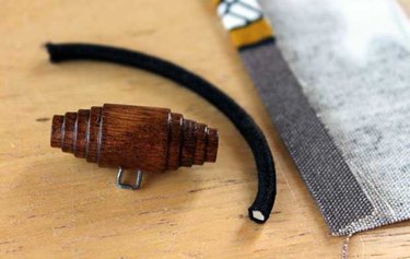 Wooden toggle and hair elastic for closure