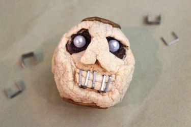 Stapled mouth on the dried-apple shrunken head