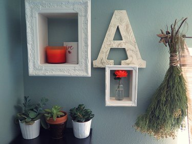 Display home decor in a shadow box frame.