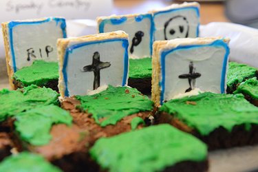 Brownies with green icing and graham cracker tombstones
