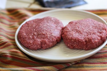 two burger patties on a plate