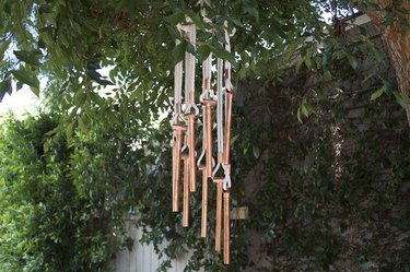 homemade wind chime in tree
