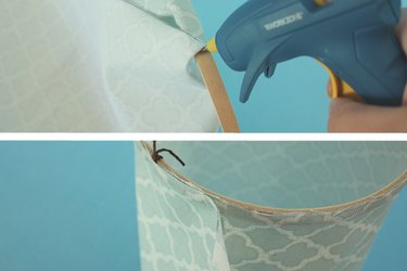 Glue the fabric to the top embroidery hoop.