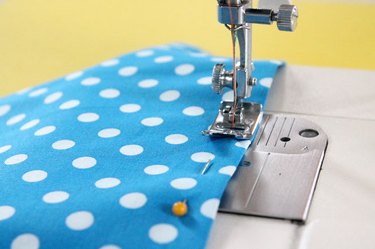 sewing fabric on sewing machine