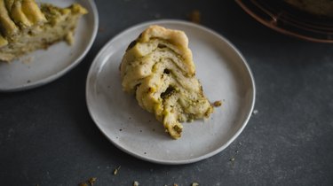 Slice the Cheesy Herb Swirl Bread to reveal gorgeous interior layers!