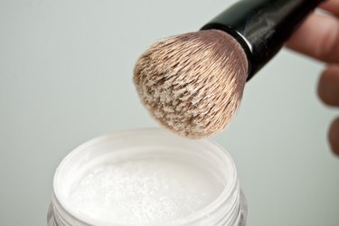 a brush with some finishing powder