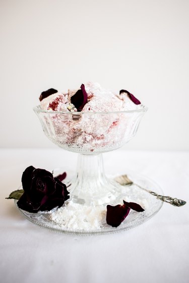 Turkish delight in a glass dish, sprinkled with rose petals..