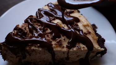 Drizzling ganache over no-bake low carb peanut butter cream cheese pie.