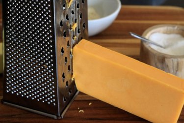 Grate the cheddar cheese.