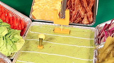 goal post made of cheese and pickle with cheese helmet to serve as football player