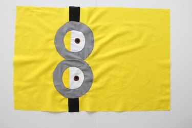Sew goggles and eyes onto front pillowcase