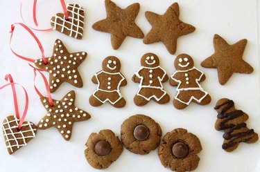 Assorted gingerbread cookies shaped like stars, hearts, circles and gingerbread men.
