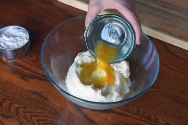 Add beaten egg to mashed potatoes.