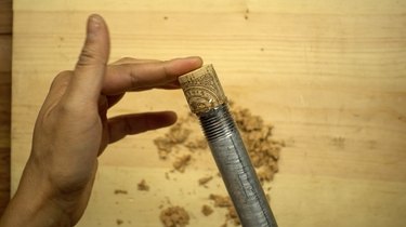 Preparing cork for DIY glass beaded garden sparkler.