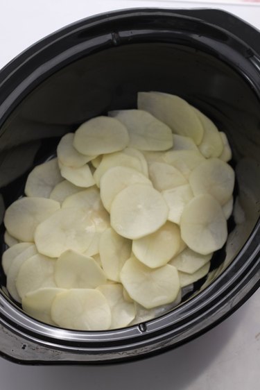 sliced potatoes in slow cooker