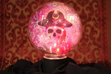 glowing crystal ball on stand