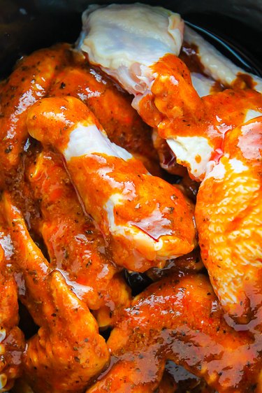 Pour buffalo sauce over wings and cook on high for one hour.