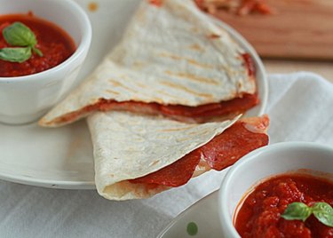 Grilled quesadillas with dipping sauce.