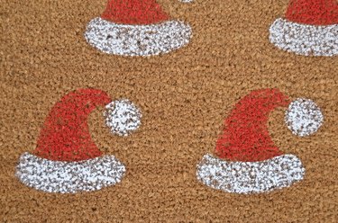 DIY red and white stenciled santa hat welcome mat