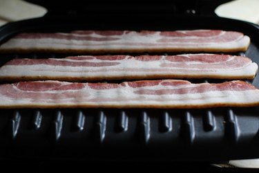 Raw bacon on a George Foreman Grill.