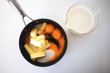 Sugar, butter, vanilla, egg yolks and evaporated milk in a medium saucepan.