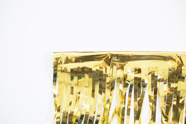 Front side of taped gold fringe garland