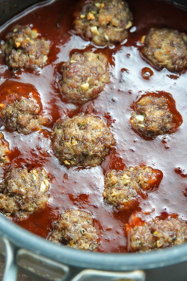Meatballs get added to cranberry barbecue sauce.