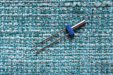 Use a double needle to hem knit fabrics.