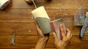 Finishing DIY candles with cement base.