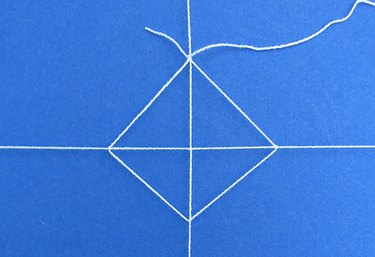 Create a diamond shape by tying knots.
