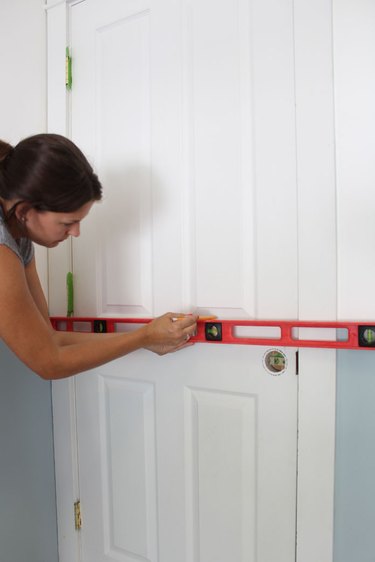 Measure and mark the interior door with a level.