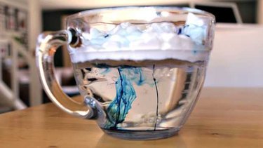 Large glass measuring cup with rain cloud displayed