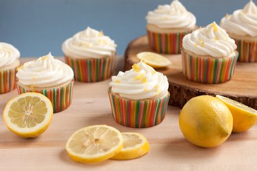Lemonade cupcakes with lemon zest garnish.