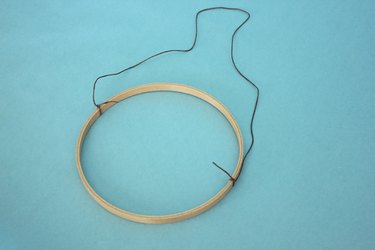 Tie the hemp cord to the embroidery hoop.