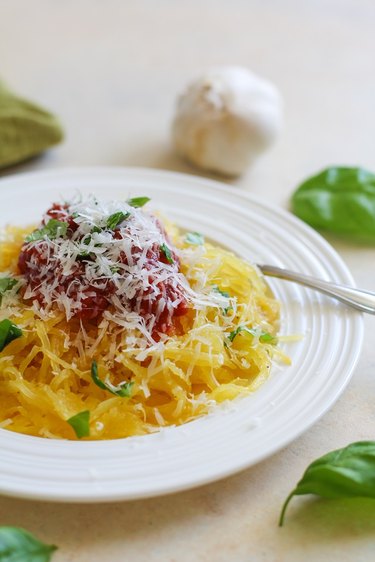 Spaghetti squash with red sauce, fresh basil, and parmesan cheese