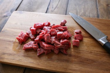 small chunks of beef on a cutting board