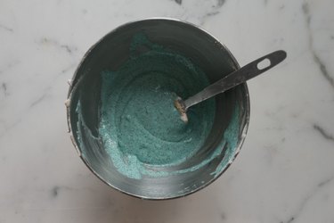 Evenly dye the macaron mixture with a few drops of the food coloring.