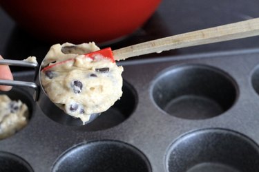 filling muffin tins