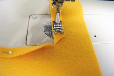 Stitching down the fold-over seam.