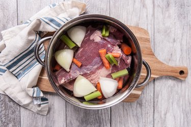 Corned beef in pot with vegetables