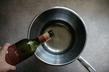Pour the wine into the bowl.